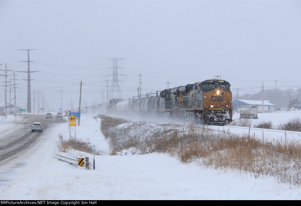 After a recrew, Q326 rolls through the heavy lake effect snow